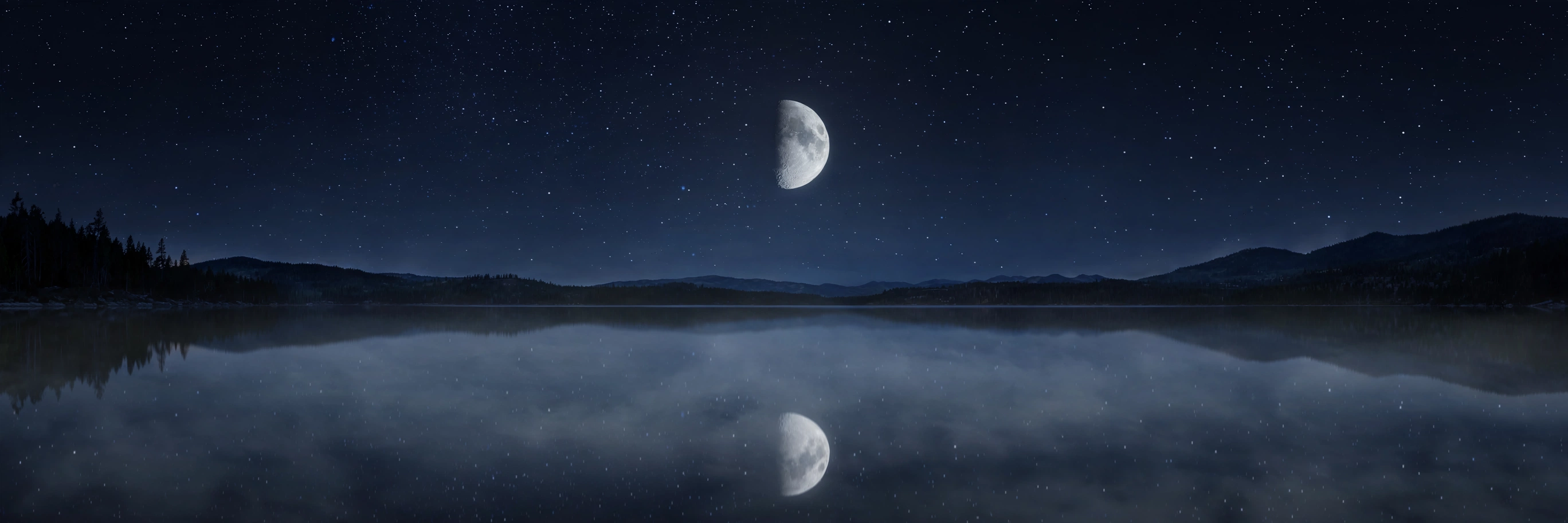 A dark, star-strewn sky over still water, the crescent-turned-half moon reflected on the surface